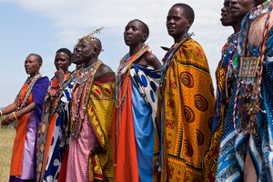 Masai women singing and dancing in a primitive village in the Masai Mara region of southwestern Kenya.